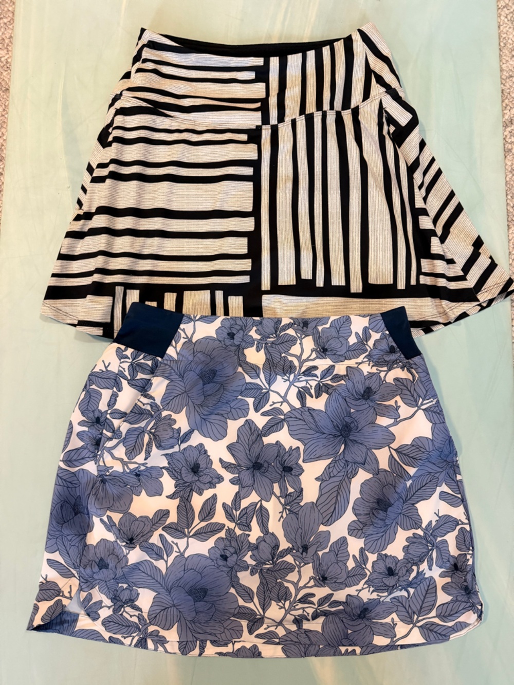 Calia Black & White Striped Skirt and Walter Hagen Blue Floral Skirt Duo